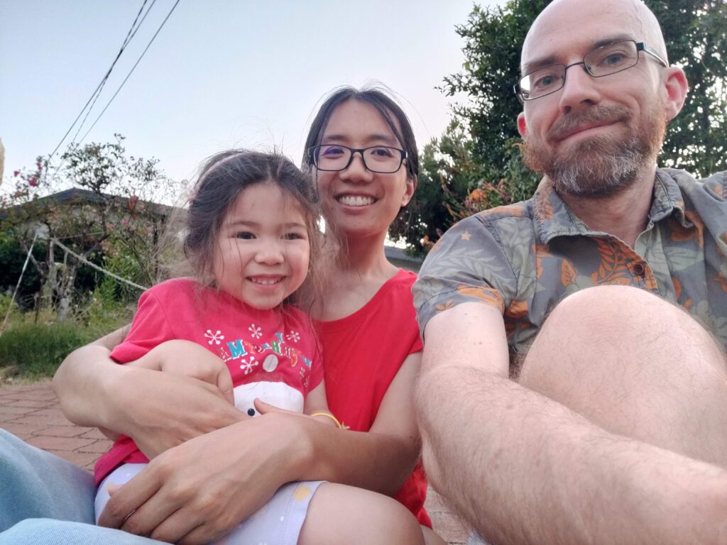 Nicholas and family outside their home